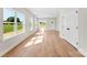 Bright and airy living area featuring beautiful flooring, and large windows with green views at 1019 S Main St, Granite Quarry, NC 28146
