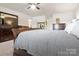 Bedroom showcasing a plaid duvet on the bed and matching wood dressers at 12101 Ranburne Rd, Mint Hill, NC 28227