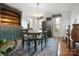 Traditional dining room with a decorative rug, wood floors, and built in storage at 12101 Ranburne Rd, Mint Hill, NC 28227