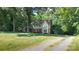 Traditional two-story home with a spacious front yard and a long driveway at 12101 Ranburne Rd, Mint Hill, NC 28227