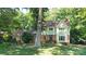 Charming two-story home with a well-manicured lawn and mature trees at 12101 Ranburne Rd, Mint Hill, NC 28227