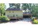 Rear exterior of home, with a spacious deck area and a two-car attached carport and landscaped yard at 12101 Ranburne Rd, Mint Hill, NC 28227