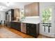 Beautifully renovated kitchen with stainless steel appliances, modern cabinets, and hardwood floors at 12101 Ranburne Rd, Mint Hill, NC 28227