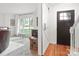 Cozy living room with a barn door, hardwood floors and neutral-colored carpet at 12101 Ranburne Rd, Mint Hill, NC 28227