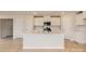 Modern kitchen with white cabinets, stainless steel appliances, and a large island, perfect for cooking at 143 Astor St, Troutman, NC 28166