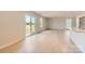 Open-concept space featuring wood floors, natural light, and sliding glass doors to the backyard at 143 Astor St, Troutman, NC 28166
