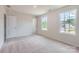 Bright bedroom with two windows, plush carpet, and neutral paint, creating a serene atmosphere at 149 Astor St, Troutman, NC 28166