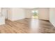 Bright living room with hardwood floors and sliding glass doors leading to the backyard at 149 Astor St, Troutman, NC 28166