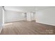 Spacious basement featuring wood-look flooring, offering versatility and room for customization at 2040 Dornoch Rd, Tega Cay, SC 29708