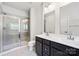 Bathroom features glass-enclosed shower, double sink vanity with ample counter space and storage at 2040 Dornoch Rd, Tega Cay, SC 29708