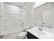 Well-lit bathroom equipped with a shower-tub combo, modern vanity, and large mirror at 2040 Dornoch Rd, Tega Cay, SC 29708