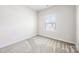 Comfortable bedroom with plush carpet, a bright window, and light-colored walls at 2040 Dornoch Rd, Tega Cay, SC 29708