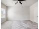 Bright bedroom featuring plush carpeting, a ceiling fan, and a large window for ample natural light at 2040 Dornoch Rd, Tega Cay, SC 29708