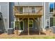 Back deck showing wooden support beams, siding, and some yard at 2040 Dornoch Rd, Tega Cay, SC 29708