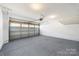 Spacious garage offering ample storage and parking space with an automatic door at 2040 Dornoch Rd, Tega Cay, SC 29708