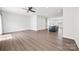 Large living room showcasing wood flooring and an open layout with a stylish island kitchen at 2040 Dornoch Rd, Tega Cay, SC 29708