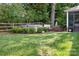 Relax in this home's backyard with a fenced yard and private hot tub surrounded by mature landscaping at 21218 Baltic Dr, Cornelius, NC 28031