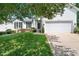 Charming home with manicured lawn, flowering shrubs, and a two-car garage at 21218 Baltic Dr, Cornelius, NC 28031