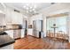 Modern kitchen featuring granite countertops, stainless steel appliances, and hardwood floors at 21218 Baltic Dr, Cornelius, NC 28031