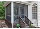 Enjoy outdoor living on this screened porch with a ceiling fan and a view of the wooded backyard at 21218 Baltic Dr, Cornelius, NC 28031
