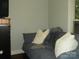 Bedroom with hardwood floors, a gray couch, and natural light from the window at 257 Rolling View Dr, New London, NC 28127