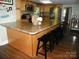 Spacious kitchen island provides seating with an open layout and plenty of counter space at 257 Rolling View Dr, New London, NC 28127