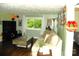 Inviting living room featuring modern decor, a large window, and hardwood floors at 257 Rolling View Dr, New London, NC 28127