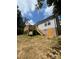 View of the backyard showcasing a wooden deck with stairs and access to the house through a door at 268 Hatley Ne Cir, Concord, NC 28025