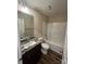 Bathroom featuring a granite-topped vanity and white-tiled shower and bathtub combo at 268 Hatley Ne Cir, Concord, NC 28025
