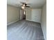 Bedroom with gray carpet, ceiling fan and closet with double doors at 268 Hatley Ne Cir, Concord, NC 28025