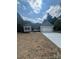 Attractive single-Gathering home with gray siding, dark shutters, and a spacious front yard at 268 Hatley Ne Cir, Concord, NC 28025