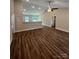Open-concept living room boasts vaulted ceilings, wood flooring, and natural light from the sliding glass doors at 268 Hatley Ne Cir, Concord, NC 28025