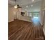 The bright living room features a ceiling fan and an open layout that flows into the kitchen and dining areas at 268 Hatley Ne Cir, Concord, NC 28025