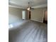Comfortable main bedroom features neutral carpeting, a ceiling fan, and ample closet space at 268 Hatley Ne Cir, Concord, NC 28025