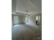Spacious main bedroom with trey ceiling, a fan, plush carpeting, and an en-suite bathroom at 268 Hatley Ne Cir, Concord, NC 28025