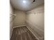 A walk-in closet with carpeted floors and metal shelving at 268 Hatley Ne Cir, Concord, NC 28025