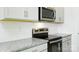 Close-up of a modern kitchen with stainless steel oven and white subway tile backsplash at 3029 Ora Smith Rd, Lincolnton, NC 28092