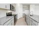 Stylish kitchen featuring granite countertops, stainless steel appliances, and light gray cabinetry at 3029 Ora Smith Rd, Lincolnton, NC 28092