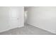 Neutral-toned bedroom with gray carpet and a doorway to the hallway at 3037 Ora Smith Rd, Lincolnton, NC 28092