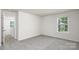 Sunlit bedroom featuring neutral walls, soft carpet, and a view to the outdoors at 3037 Ora Smith Rd, Lincolnton, NC 28092