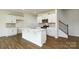 Modern kitchen with white cabinets, a kitchen island, stainless steel appliances, and hardwood floors at 3037 Ora Smith Rd, Lincolnton, NC 28092
