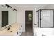 Well-lit bathroom featuring a double vanity, modern fixtures, and a walk-in shower at 3422 Balsam Tree Dr, Charlotte, NC 28269