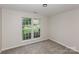 Neutral bedroom with plush carpet and large window offering bright natural light at 3422 Balsam Tree Dr, Charlotte, NC 28269