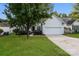 Charming home featuring a well-manicured lawn, mature trees, and a bright white exterior at 3422 Balsam Tree Dr, Charlotte, NC 28269