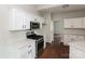 Modern kitchen featuring stainless steel appliances, white cabinetry, and bright countertops at 3422 Balsam Tree Dr, Charlotte, NC 28269