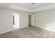 Cozy main bedroom with tray ceiling, plush carpeting, and an en-suite bathroom at 3422 Balsam Tree Dr, Charlotte, NC 28269