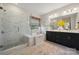 Luxurious bathroom with a freestanding tub, glass-enclosed shower, and sleek vanity at 4010 Caymen Bay Ct, Tega Cay, SC 29708