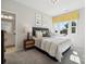 Bright bedroom featuring a large window, stylish decor, a decorative headboard, and a comfortable bed at 4010 Caymen Bay Ct, Tega Cay, SC 29708