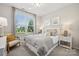 Cozy bedroom with neutral tones, a large window, and stylish decor, creating a relaxing atmosphere at 4010 Caymen Bay Ct, Tega Cay, SC 29708