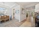 Elegant dining area with wainscoting, hardwood floors, and a view into other rooms in the house at 4010 Caymen Bay Ct, Tega Cay, SC 29708